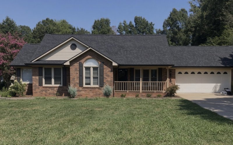 Brick ranch home with a new charcoal designer shingle roof by CPR