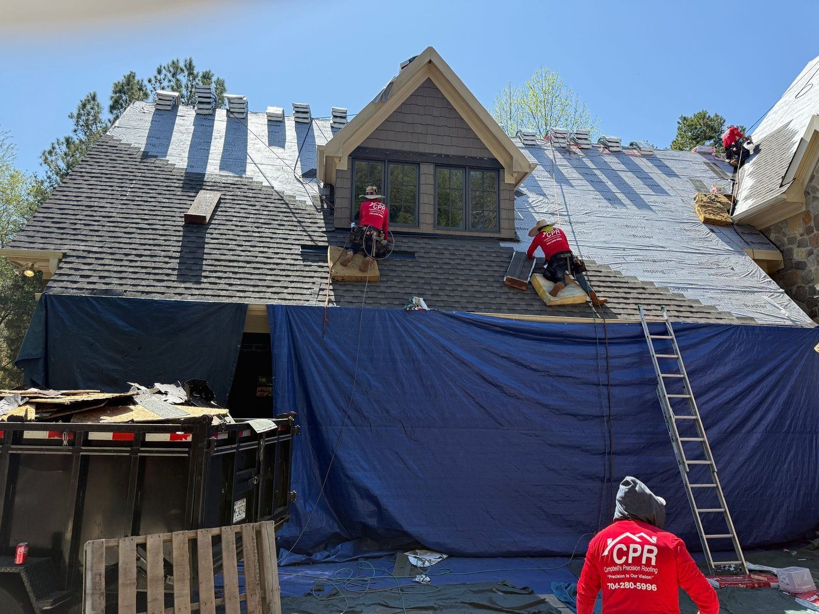 Multi-level home roofing project in progress near Denver NC