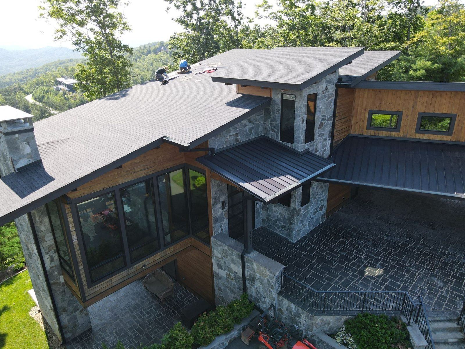 Aerial view of a new-construction home with roofing in progress